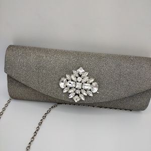 Women silver clutch bag. Faux stones.